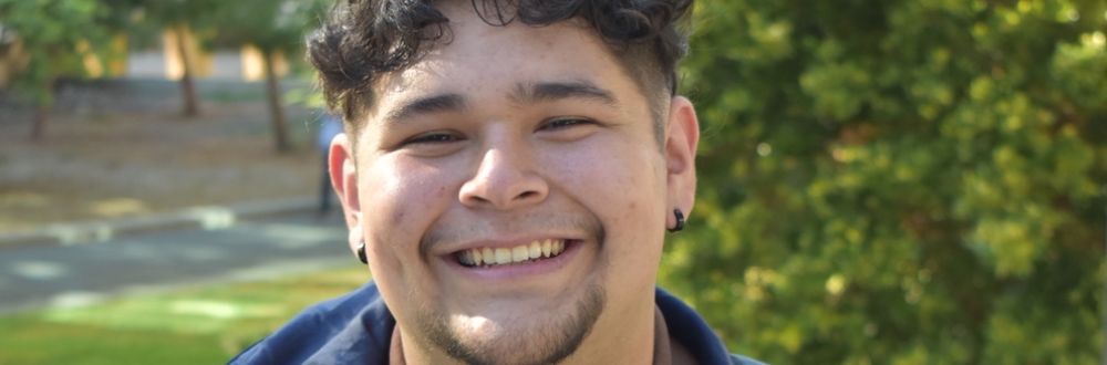 SAE alumni Matt Garcia-Ramirez smiles at the camera