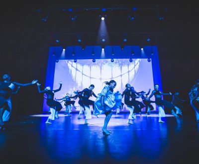 14 dancers in performance