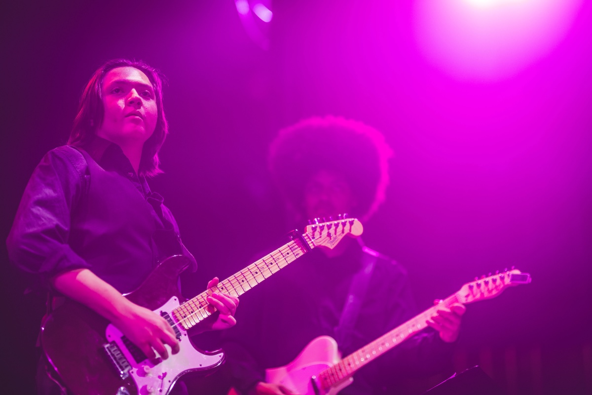 two students performing guitar on stage at The School of Arts and Enterprise tuition and audition free charter school