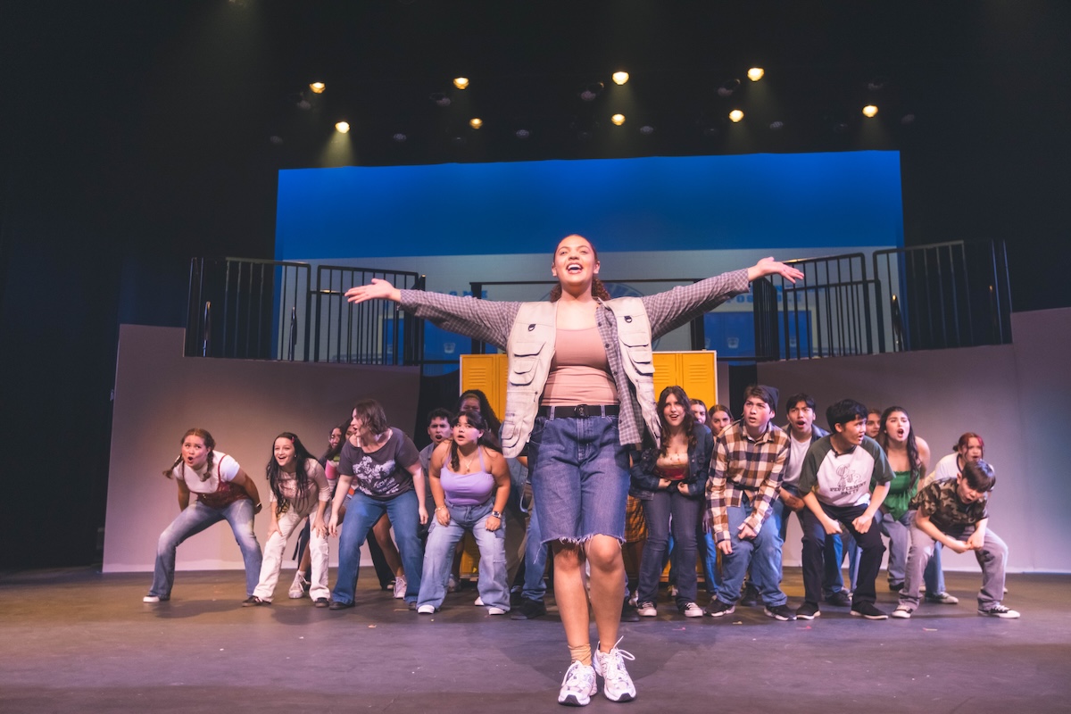 students at The School of Arts and Enterprise tuition free charter school on stage during a musical theater performance